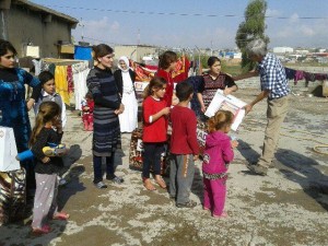 Distributing electric heaters in Iraq to refugees